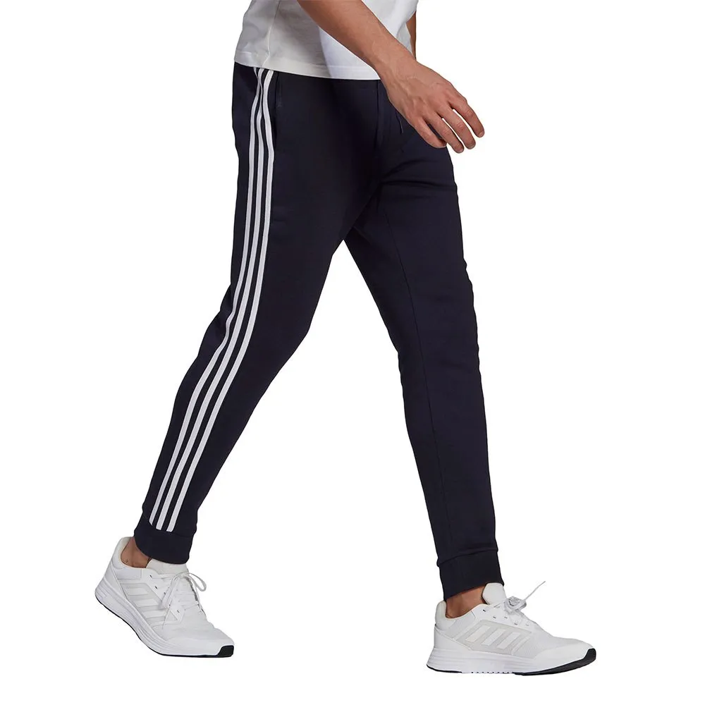 Adidas Sportswear Essentials Fleece Tapered Cuff 3-Stripes Pants 1 Adidas Sportswear Essentials Fleece Tapered Cuff 3-Stripes Pants